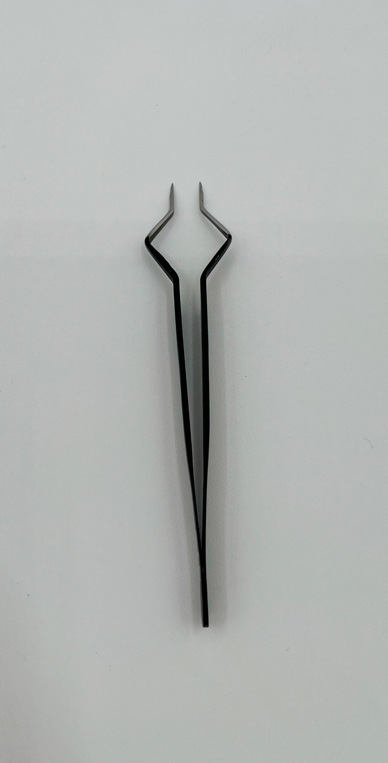 Isolating Tweezer